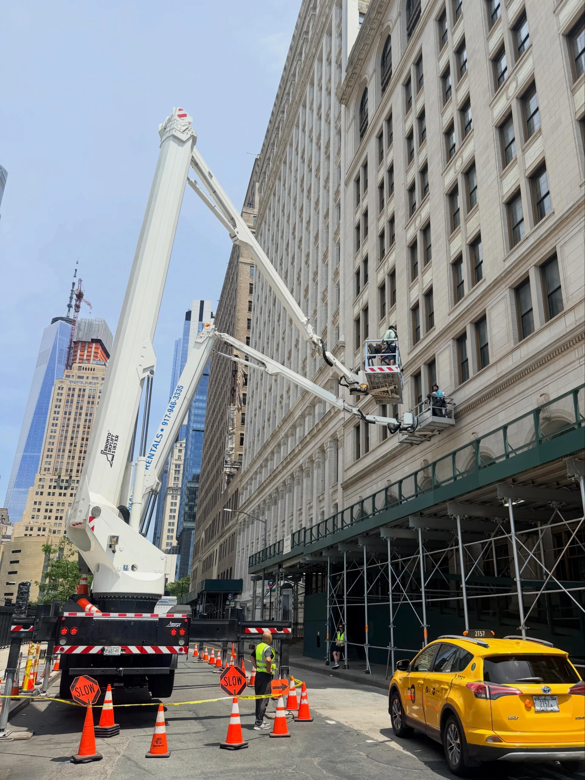 Aerial lift at a building for post-construction window cleaning