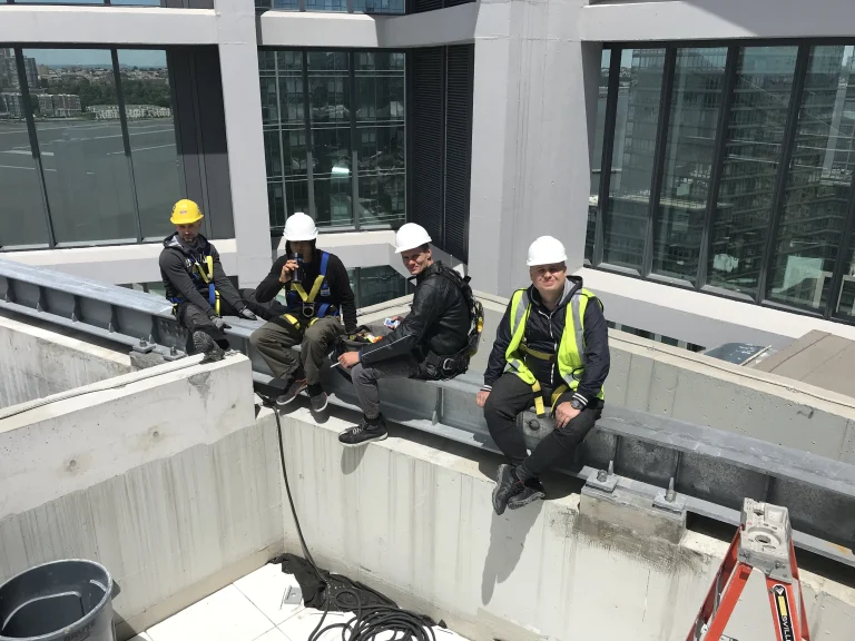 Skyway Windows crew in hard hats on a rooftop